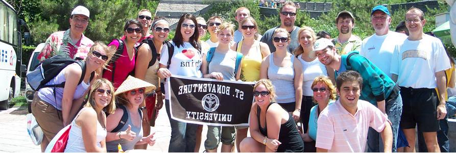 Students posing with a St. Bonaventure banner in China